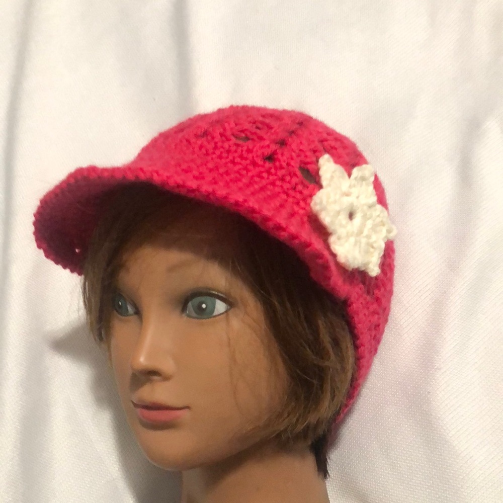 Pink and White Crocheted Hat with Flower Decoration